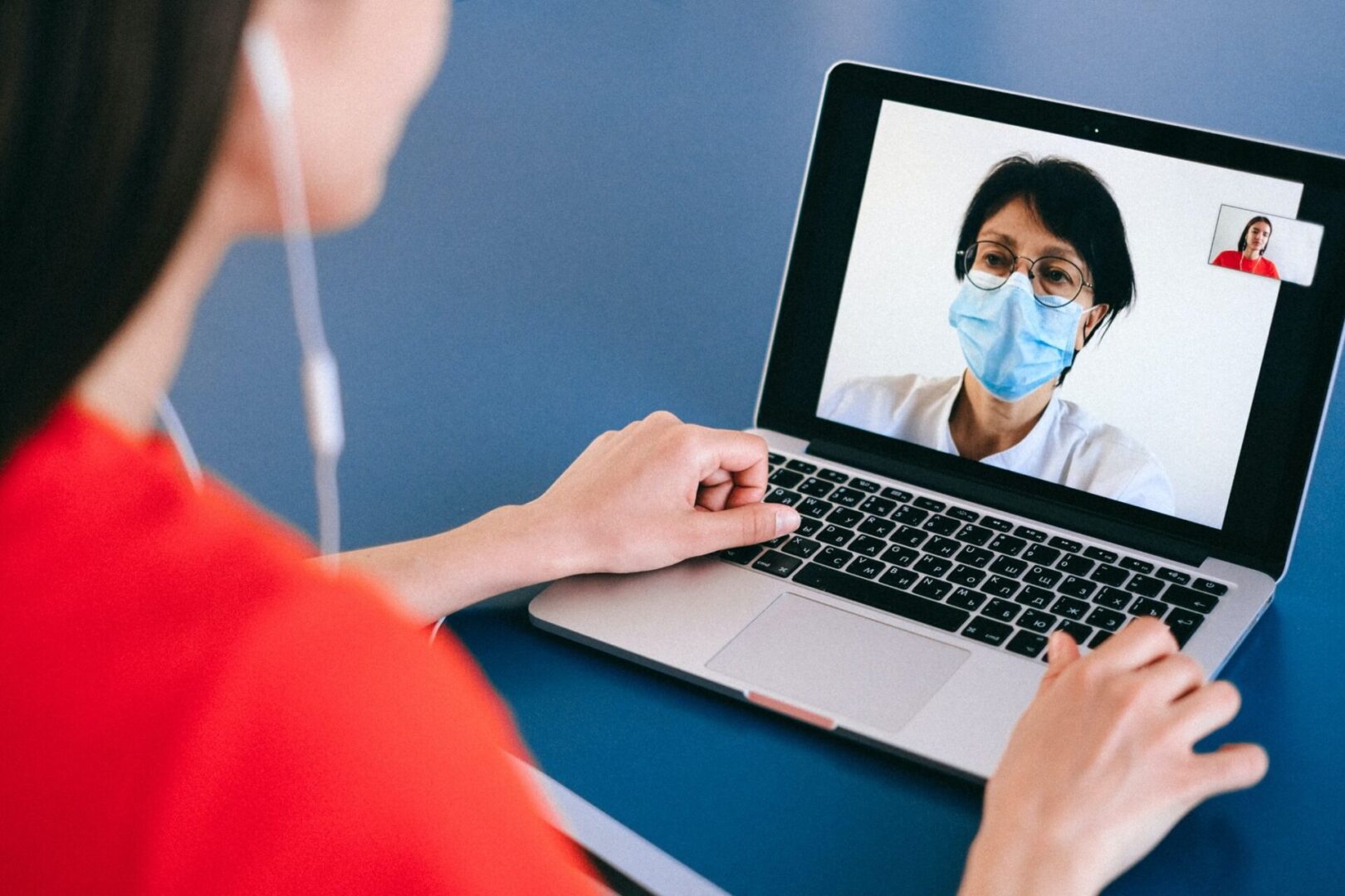 Woman is Using Laptop for Remote Conversation